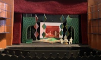 a model of a theatre set with people in it